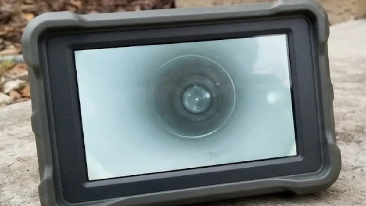 Monitor showing a sewer camera view inside a pipe during a sewer inspection in Mission Viejo